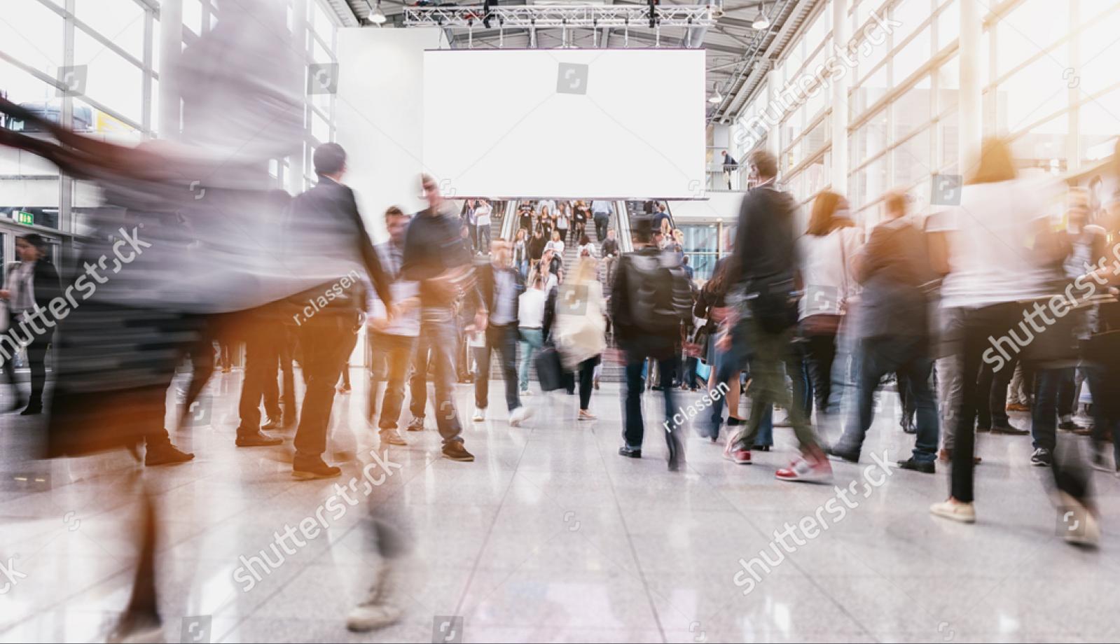 stock-photo-anonymous-people-at-a-trade-fair-740564119.jpg